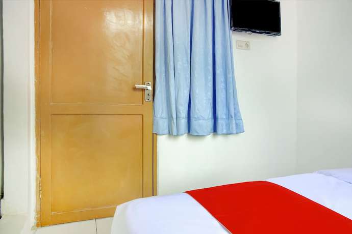 Imagen de la habitación del Hotel SPOT ON 3286 Ramania Residence Syariah. Foto 13