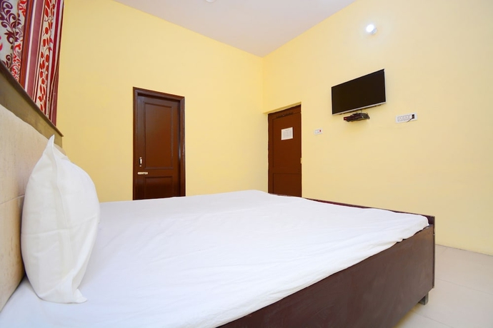 Imagen de la habitación del Hotel SPOT ON 38845 Gursimran Complex. Foto 9