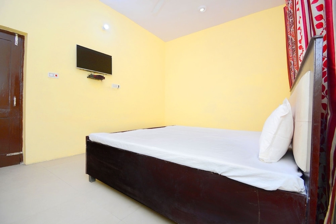 Imagen de la habitación del Hotel SPOT ON 38845 Gursimran Complex. Foto 11