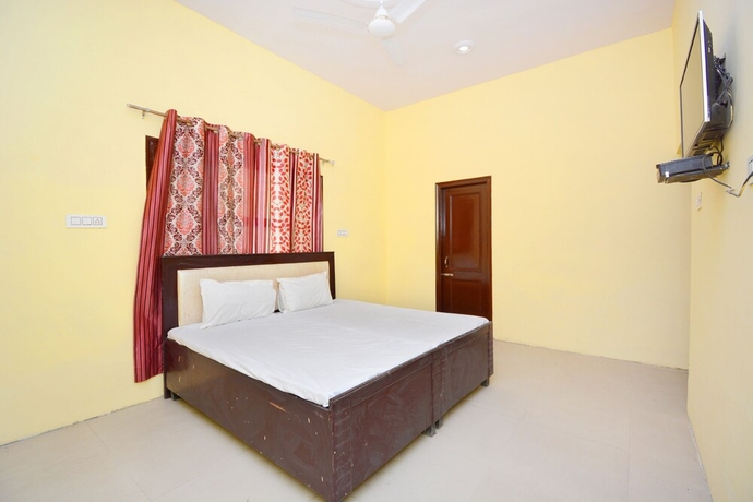 Imagen de la habitación del Hotel SPOT ON 38845 Gursimran Complex. Foto 12