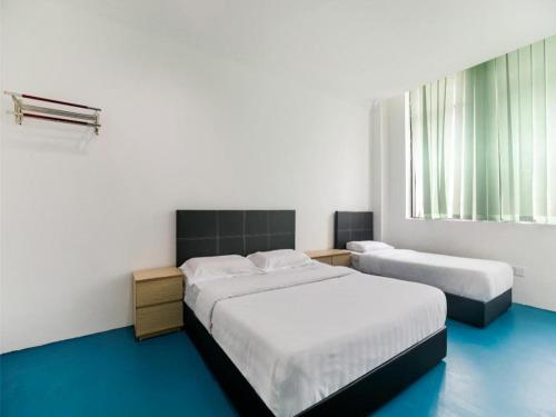 Imagen de la habitación del Hotel SPOT ON 89726 Capsule Inn. Foto 18