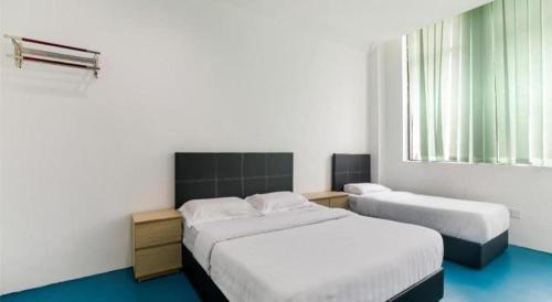 Imagen de la habitación del Hotel SPOT ON 89726 Capsule Inn. Foto 20
