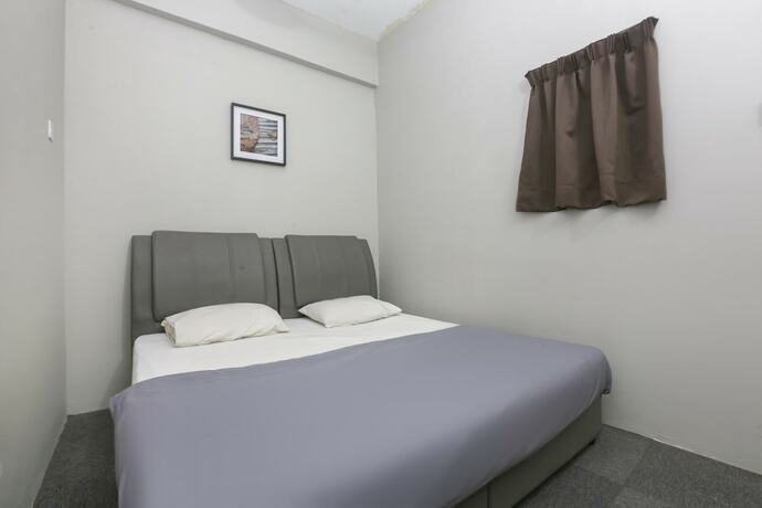 Imagen de la habitación del Hotel SPOT ON 89751 Bed Station Guest House - Hostel. Foto 13