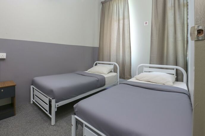 Imagen de la habitación del Hotel SPOT ON 89751 Bed Station Guest House - Hostel. Foto 16