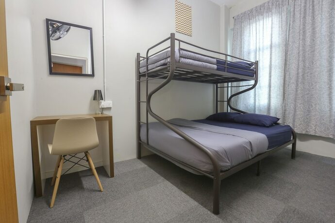 Imagen de la habitación del Hotel SPOT ON 89751 Bed Station Guest House - Hostel. Foto 17