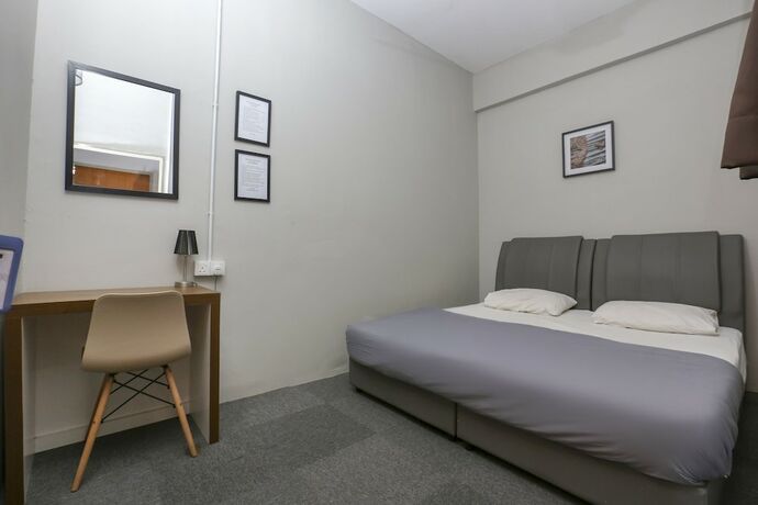 Imagen de la habitación del Hotel SPOT ON 89751 Bed Station Guest House - Hostel. Foto 19