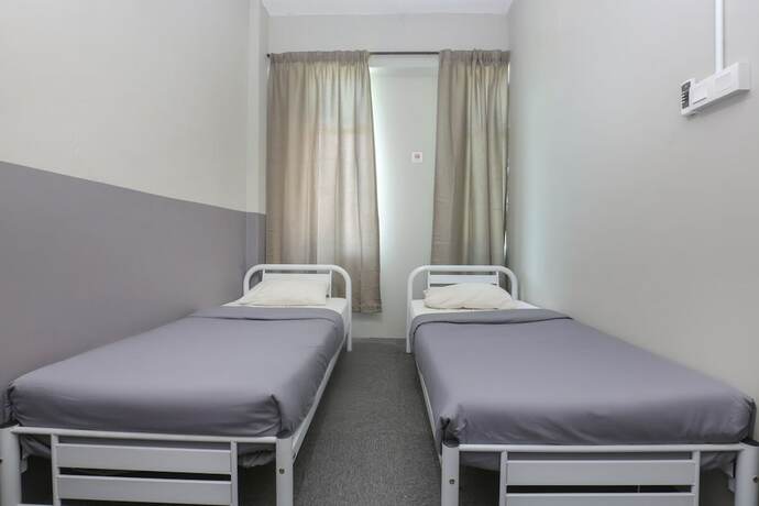Imagen de la habitación del Hotel SPOT ON 89751 Bed Station Guest House - Hostel. Foto 20