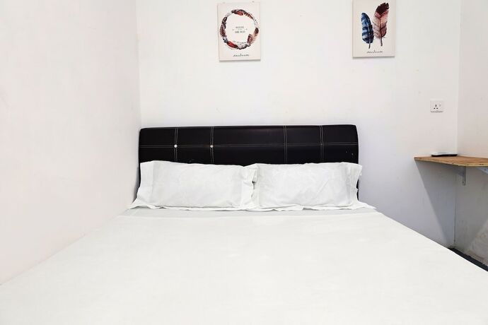 Imagen de la habitación del Hotel SPOT ON 89805 The Traveler Home. Foto 15