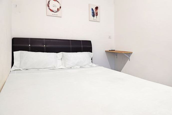 Imagen de la habitación del Hotel SPOT ON 89805 The Traveler Home. Foto 16