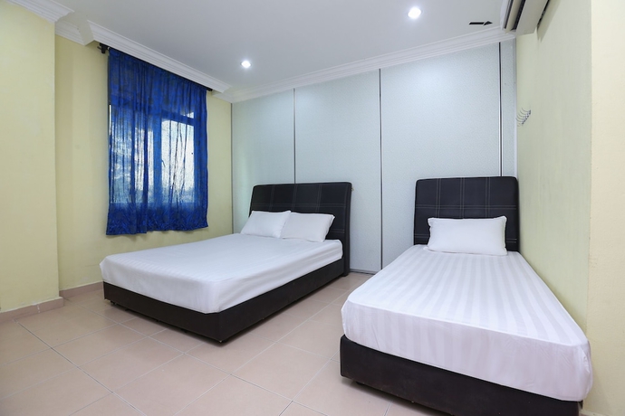 Imagen de la habitación del Hotel SPOT ON 89857 Azra Inn Rumah Tumpangan. Foto 7