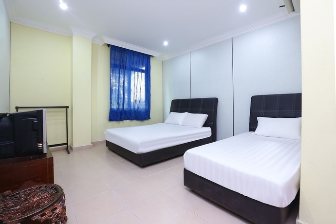 Imagen de la habitación del Hotel SPOT ON 89857 Azra Inn Rumah Tumpangan. Foto 9