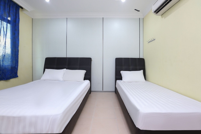 Imagen de la habitación del Hotel SPOT ON 89857 Azra Inn Rumah Tumpangan. Foto 10
