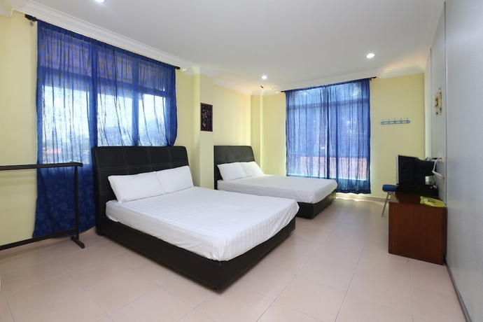 Imagen de la habitación del Hotel SPOT ON 89857 Azra Inn Rumah Tumpangan. Foto 16