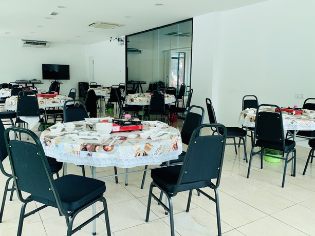 Imagen del bar/restaurante del Hotel SPOT ON 89900 Jesselton Capsule Inn. Foto 3