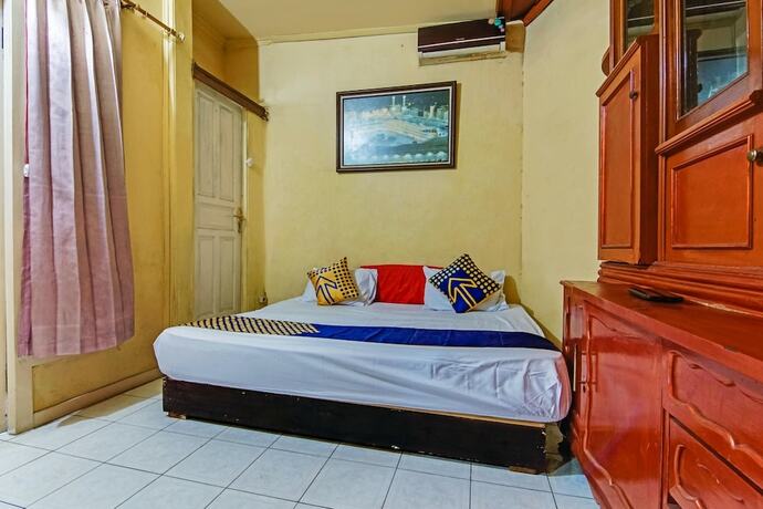 Imagen de la habitación del Hotel SPOT ON 90060 Jq Homestay Syariah. Foto 19