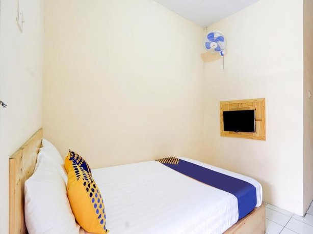 Imagen de la habitación del Hotel SPOT ON 90156 Ramayana. Foto 11