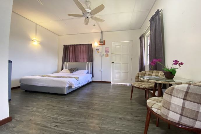 Imagen de la habitación del Hotel SPOT ON 90279 Kinomulok Garden. Foto 5