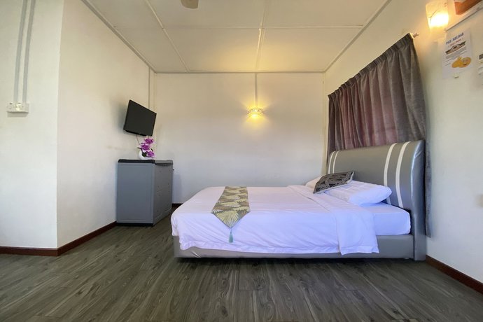 Imagen de la habitación del Hotel SPOT ON 90279 Kinomulok Garden. Foto 6