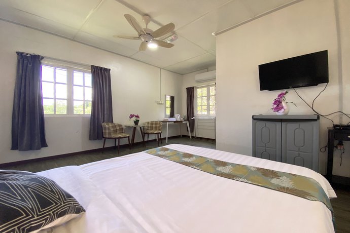 Imagen de la habitación del Hotel SPOT ON 90279 Kinomulok Garden. Foto 11