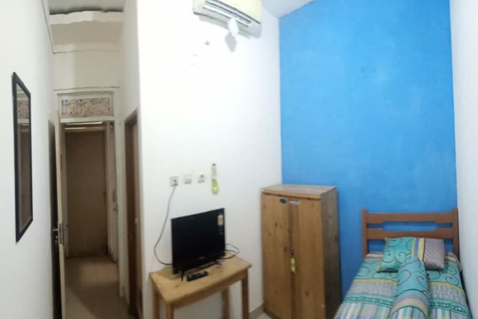 Imagen de la habitación del Hotel SPOT ON 90538 Wisma Dewi Syariah. Foto 4