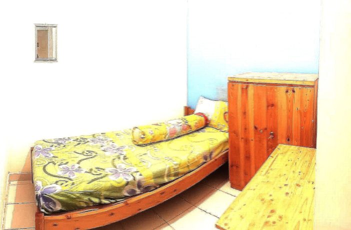 Imagen de la habitación del Hotel SPOT ON 90538 Wisma Dewi Syariah. Foto 5