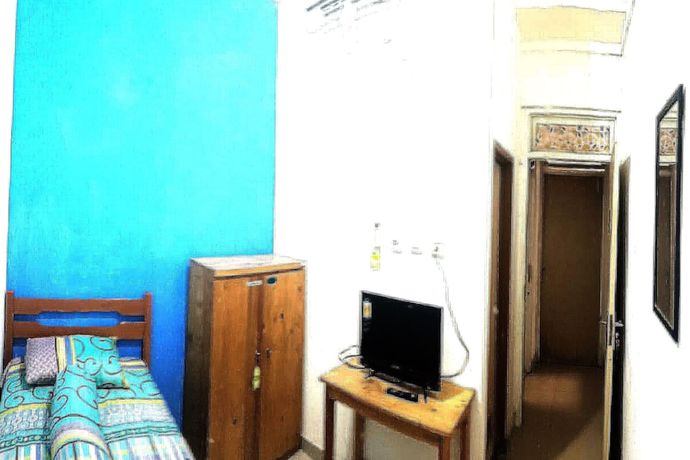 Imagen de la habitación del Hotel SPOT ON 90538 Wisma Dewi Syariah. Foto 7