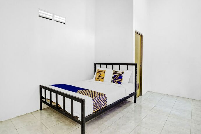 Imagen de la habitación del Hotel SPOT ON 90742 Kinanthy Homestay Syariah. Foto 20