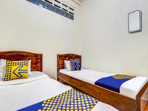 Imagen de la habitación del Hotel SPOT ON 90744 Alika Homestay. Foto 18