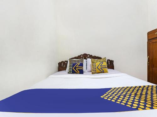 Imagen de la habitación del Hotel SPOT ON 90744 Alika Homestay. Foto 19