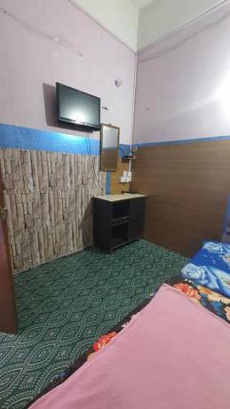 Imagen de la habitación del Hotel SPOT ON 90836 Penginapan Almera. Foto 15