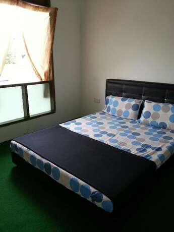 Imagen de la habitación del Hotel SPOT ON 90870 Karim Ct Guest House. Foto 9