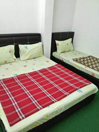 Imagen de la habitación del Hotel SPOT ON 90870 Karim Ct Guest House. Foto 10