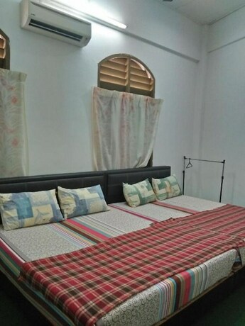 Imagen de la habitación del Hotel SPOT ON 90870 Karim Ct Guest House. Foto 12