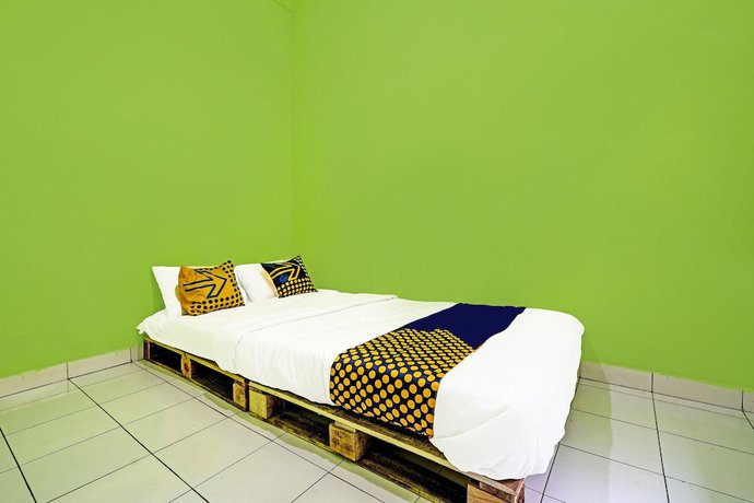 Imagen de la habitación del Hotel SPOT ON 91325 Pondok Hijau Guest House Syariah. Foto 11