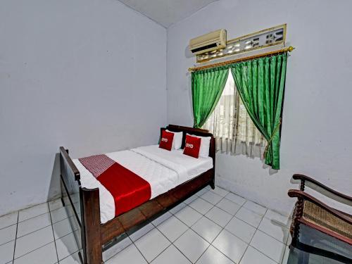 Imagen de la habitación del Hotel SPOT ON 91372 Wisma Bulin. Foto 18