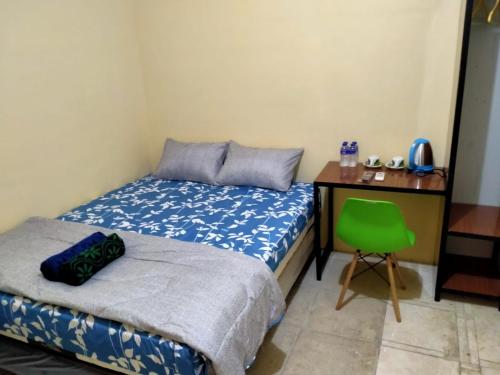 Imagen de la habitación del Hotel SPOT ON 91402 Home\'59 Tegal Danas. Foto 20