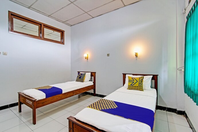 Imagen de la habitación del Hotel SPOT ON 91471 Syariah Wisma Uin Walisongo. Foto 17