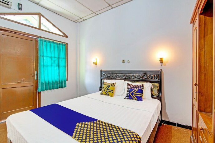 Imagen de la habitación del Hotel SPOT ON 91471 Syariah Wisma Uin Walisongo. Foto 19