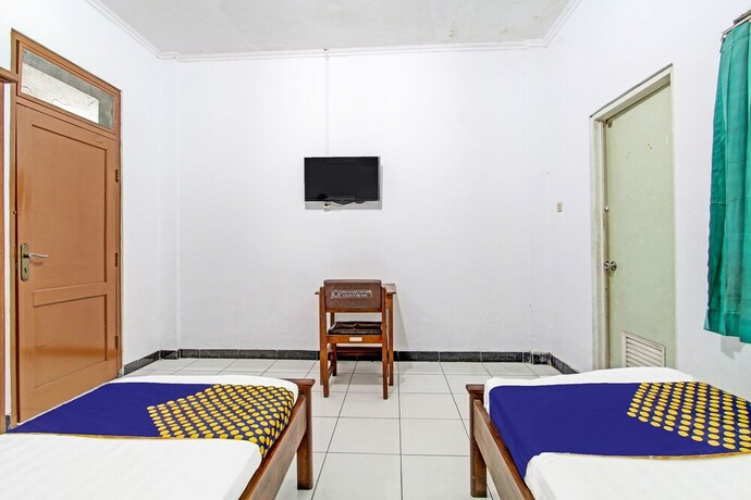 Imagen de la habitación del Hotel SPOT ON 91471 Syariah Wisma Uin Walisongo. Foto 20