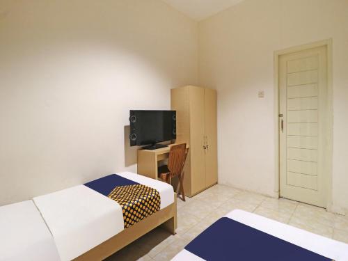 Imagen general del Hotel SPOT ON 91504 De Vila Ungu Syariah. Foto 10