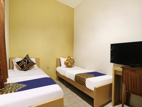 Imagen general del Hotel SPOT ON 91504 De Vila Ungu Syariah. Foto 11