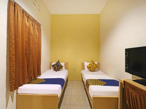 Imagen general del Hotel SPOT ON 91504 De Vila Ungu Syariah. Foto 14