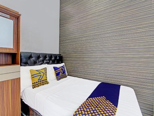 Imagen de la habitación del Hotel SPOT ON 91523 Kenari Guesthouse. Foto 19