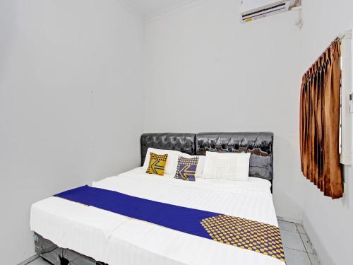 Imagen de la habitación del Hotel SPOT ON 91523 Kenari Guesthouse. Foto 20