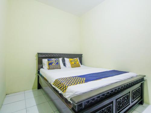 Imagen de la habitación del Hotel SPOT ON 91606 Nadin Guest House Syariah. Foto 20