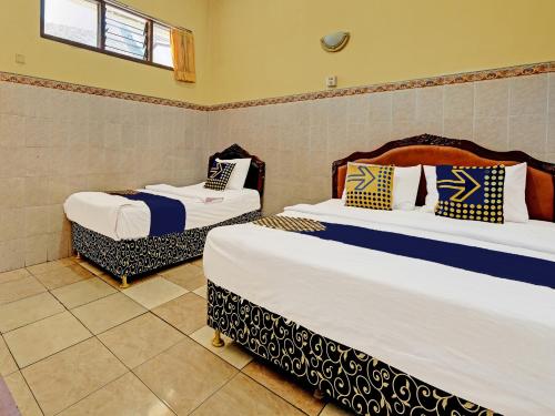 Imagen de la habitación del Hotel SPOT ON 91677 Citra Dewi 3. Foto 20