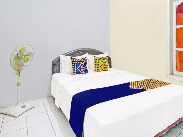 Imagen de la habitación del Hotel SPOT ON 91764 Griya Amarta Syariah. Foto 19