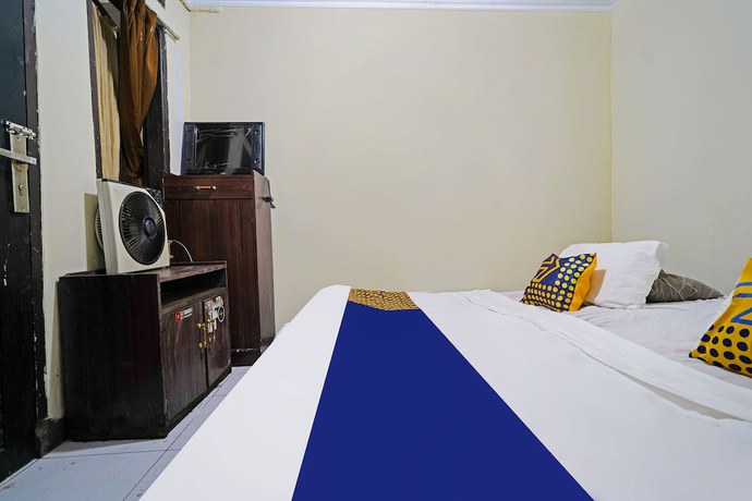 Imagen de la habitación del Hotel SPOT ON 91783 Urban Syariah Residence. Foto 2