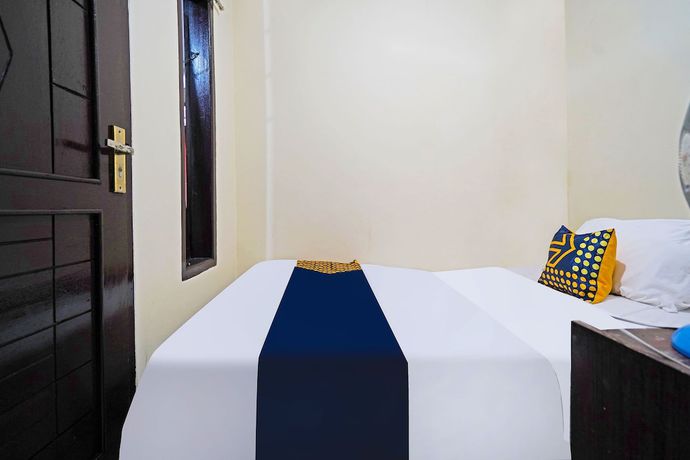 Imagen de la habitación del Hotel SPOT ON 91783 Urban Syariah Residence. Foto 6