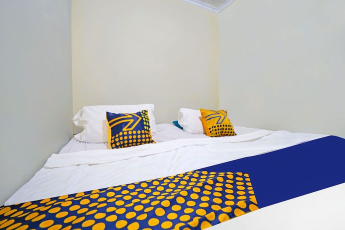Imagen de la habitación del Hotel SPOT ON 91783 Urban Syariah Residence. Foto 7
